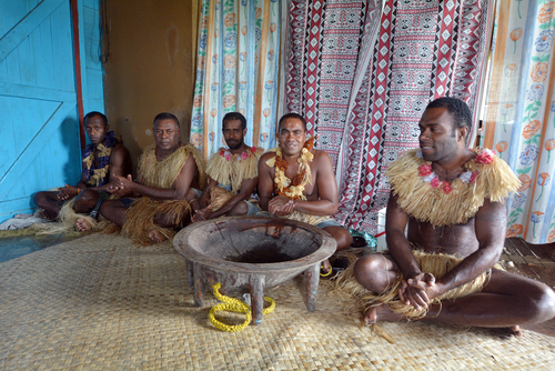 indigenous peoples sitting drinking kava